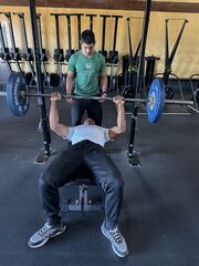 Squatting with resistance band for upper extremity