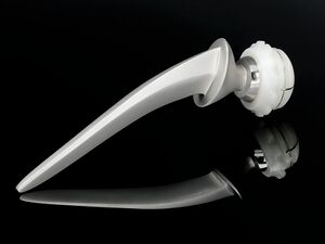 Stainless steel and ultra high molecular weight polythene Total Hip Replacement