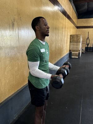 Bicep Curl- this is a open chain exercise that targets the elbow flexors and forearm supinators.